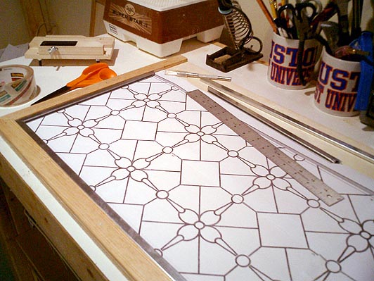 One of the workboards for one of the dogwood windows, with a draft pattern and cut-to-size zinc too.