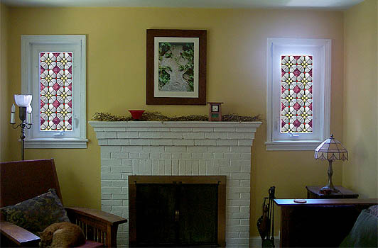 Photo of our living room with pretty stained glass Photoshopped in over the windows on either side of the fireplace.